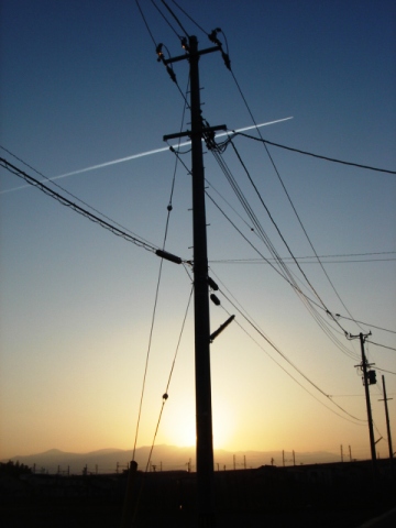 夕日と飛行機雲